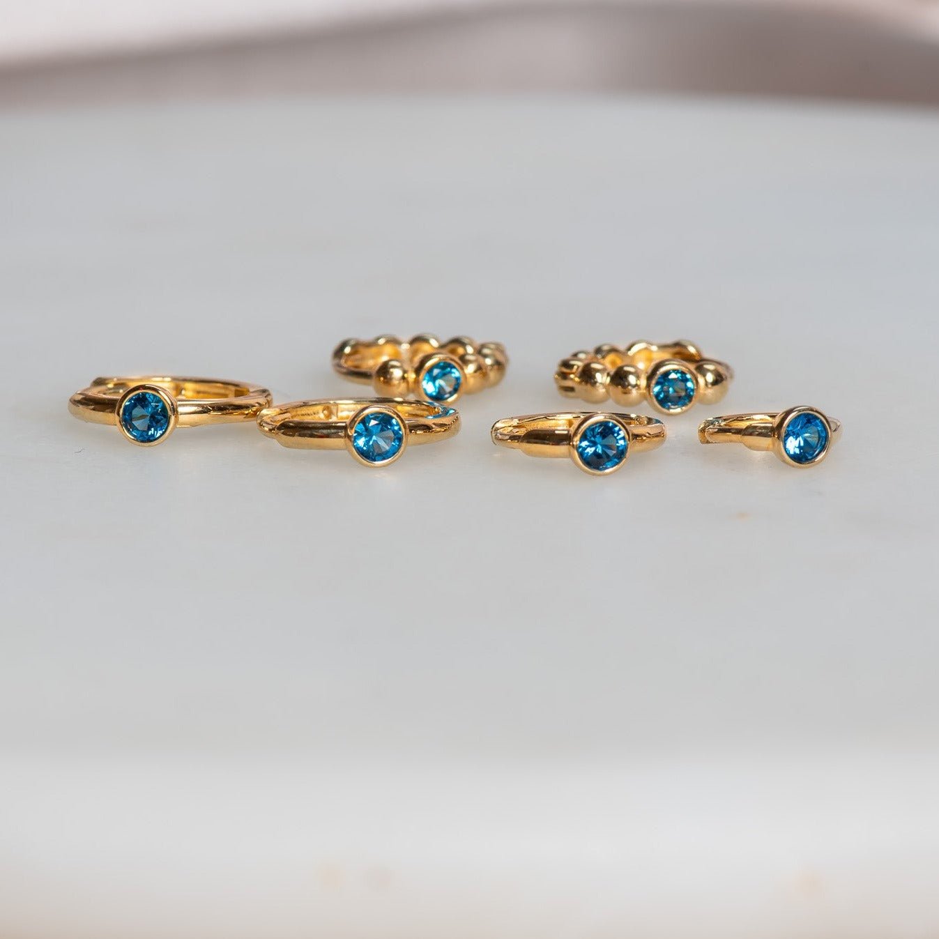 Bezel Set Blue Topaz Huggie in 14k Gold Earrings Estellacollection #product_description# 18368 blue Blue Gemstone cartilage hoop #tag4# #tag5# #tag6# #tag7# #tag8# #tag9# #tag10# 6mm Single Hoop