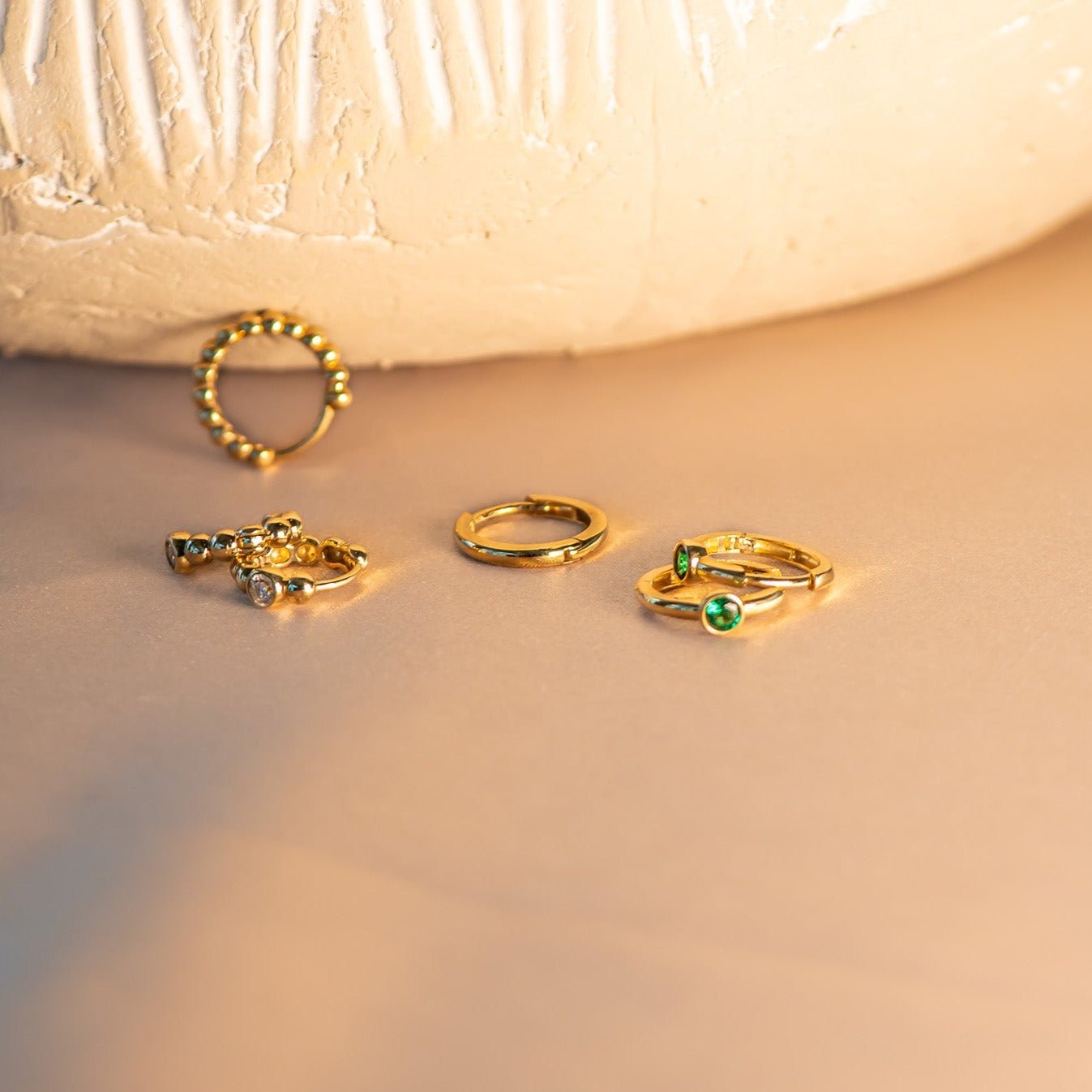 Bezel Set Emerald Huggie in 14k Gold Earrings Estellacollection #product_description# 18367 14k Birthstone Birthstone Earrings #tag4# #tag5# #tag6# #tag7# #tag8# #tag9# #tag10# 6mm Single Hoop