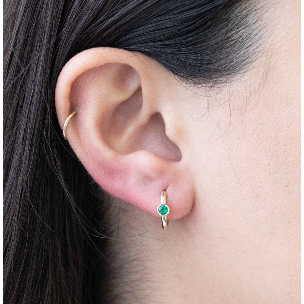 Bezel Set Emerald Huggie in 14k Gold Earrings Estellacollection #product_description# 18367 14k Birthstone Birthstone Earrings #tag4# #tag5# #tag6# #tag7# #tag8# #tag9# #tag10# 6mm Single Hoop