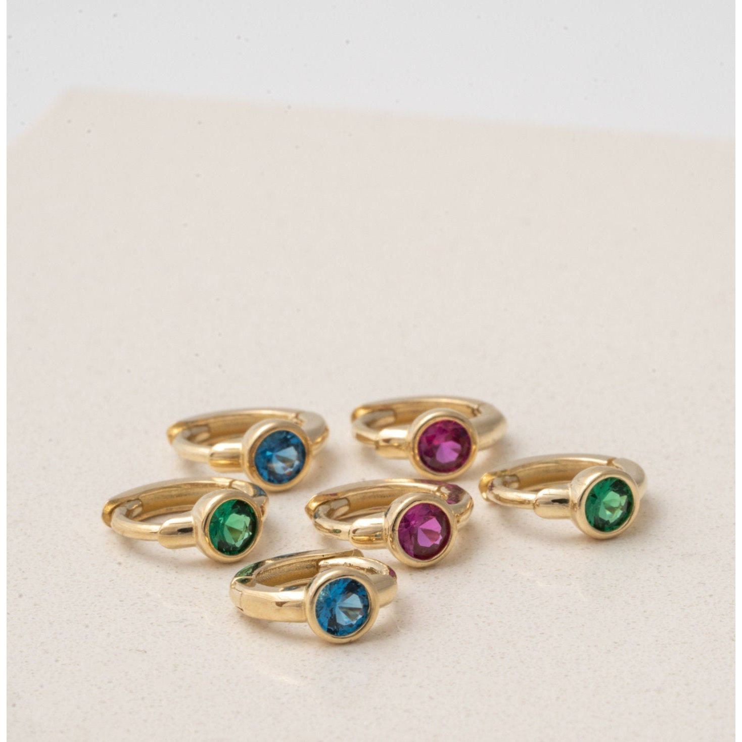 Bezel Set Emerald Huggie in 14k Gold Earrings Estellacollection #product_description# 18367 14k Birthstone Birthstone Earrings #tag4# #tag5# #tag6# #tag7# #tag8# #tag9# #tag10# 6mm Single Hoop